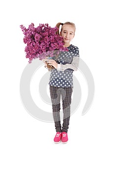 Girl teenager standing with lilac in hands