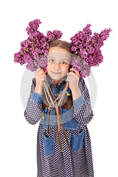 Girl teenager standing with lilac in hands