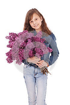 Girl teenager standing with lilac in hands