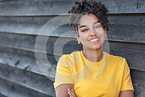 Girl teenager teen female young African American woman outside smiling with perfect teeth