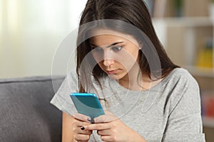 Girl texting obsessed with a smart phone photo