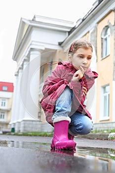 A girl with a thoughtful expression on her face