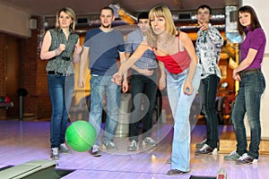 Girl throw ball for bowling, friends worry for it