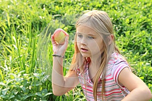 Girl throwing an apple