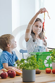 Girl throwing away biological waste