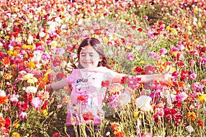 Girl throwing flower petals