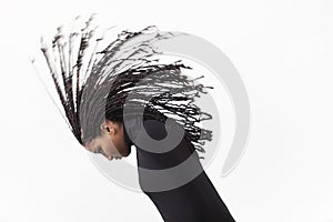 Girl throwing her braids