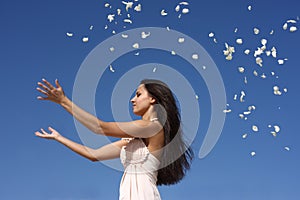 Girl throwing petals