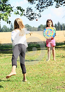 Girl throwing on a target