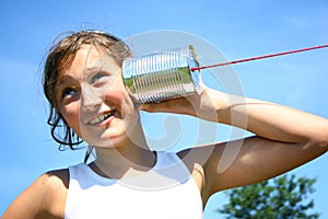 Girl with tin can phone