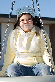 Girl On Tire Swing photo