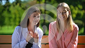 Girl tired of listening to gossip and news of annoying friend, envy, selfishness