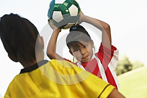 Girl About To Throw The Soccer Ball