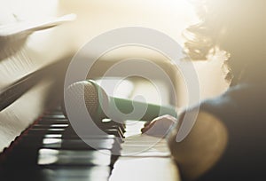 Girl toddler, piano and toy microphone