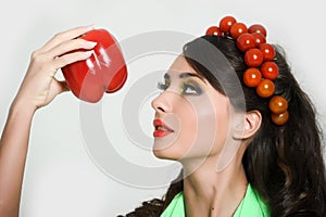 Girl with tomatoes on her head.