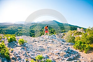 Girl at the top of the mountain.