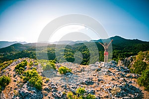 Girl at the top of the mountain