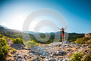 Girl at the top of the mountain