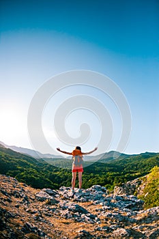 Girl at the top of the mountain