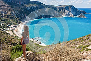 Girl on the top opposite Petani Beach on the Kefalonia Island, Greece