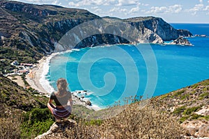 Girl on the top opposite Petani Beach on the Kefalonia Island, Greece