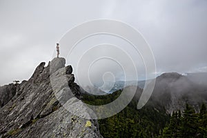 Girl on top of a Rocky Canadian Mountain