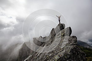 Girl on top of a Rocky Canadian Mountain