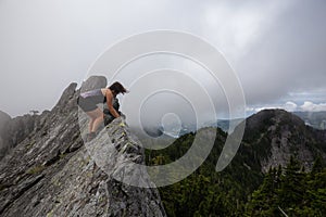 Girl on top of a Rocky Canadian Mountain