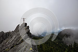 Girl on top of a Rocky Canadian Mountain