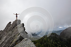 Girl on top of a Rocky Canadian Mountain