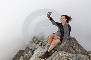 Girl on top of a Rocky Canadian Mountain