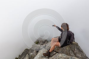 Girl on top of a Rocky Canadian Mountain