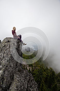 Girl on top of a Rocky Mountain