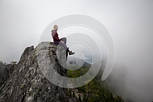 Girl on top of a Rocky Mountain