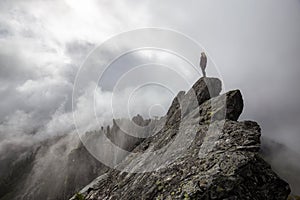 Girl on top of a Rocky Mountain