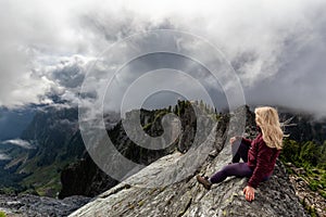 Girl on top of a Rocky Mountain