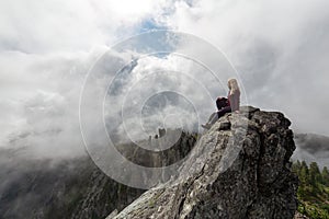 Girl on top of a Rocky Mountain