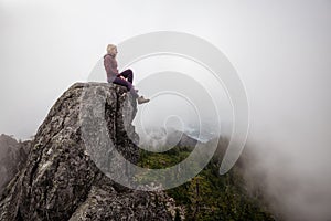 Girl on top of a Rocky Mountain