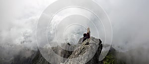 Girl on top of a Rocky Mountain