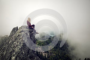 Girl on top of a Rocky Mountain