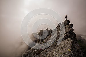 Girl on top of a Rocky Mountain