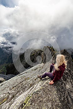 Girl on top of a Rocky Mountain