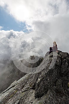 Girl on top of a Rocky Mountain