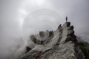 Girl on top of a Rocky Mountain