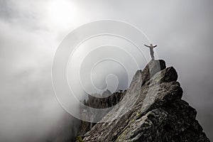 Girl on top of a Rocky Mountain