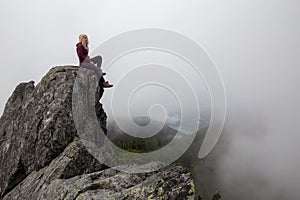 Girl on top of a Rocky Mountain