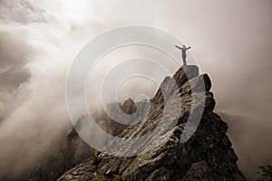 Girl on top of a Rocky Mountain