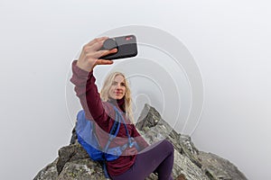 Girl on top of a Rocky Mountain