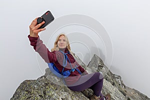 Girl on top of a Rocky Mountain