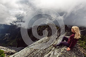 Girl on top of a Rocky Mountain